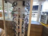a display of watches in a glass case in a store