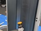 a machine that is sitting on the floor in the gym