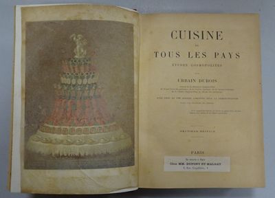 an open book with a picture of a cake on top of it