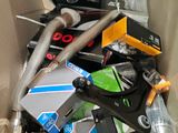 a cardboard box filled with assorted items including a pair of scissors and a pair of scissors