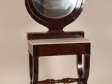 a small table with a mirror on top of it