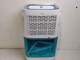 a small air conditioner sitting on the floor next to a wall
