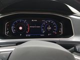 a close up of a car dashboard with a steering wheel