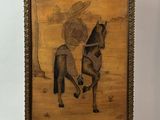 an image of a painting of a man riding a horse on a wooden stand
