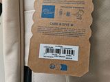 a label on the back of a suitcase that says care and give