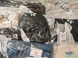 a pile of clothing that is sitting on a table