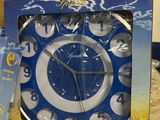a box with a clock inside of it on a table