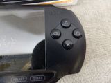 a close up of a video game controller on a table