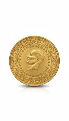 gros plan d'une pièce d'or sur laquelle figure le visage d'un homme