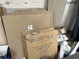 a pile of boxes and other items that are in a room
