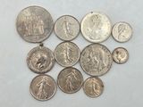 a close up of a bunch of coins on a table