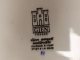 the plate has a castle design on it and is white with black trim