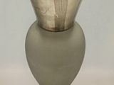 a glass vase that is sitting on a table