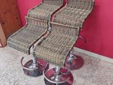 pair of wicker bar stools with chrome wheels