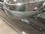 a close up of a car ' s front bumper with a mirror