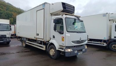 a white truck that is parked next to other trucks