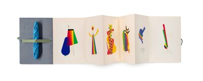 an open book with a picture of different colored ties on it