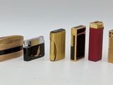 a lot of lighters that are lined up on the table