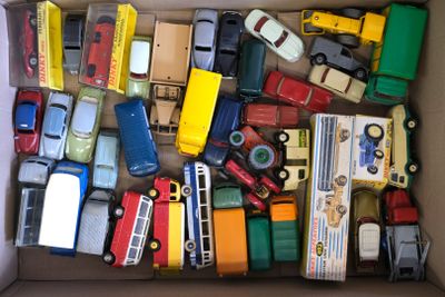 a box full of toy cars and trucks that are in it