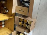 a refrigerator with many jars of food inside of it