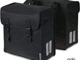 a pair of black bags sitting on top of each other