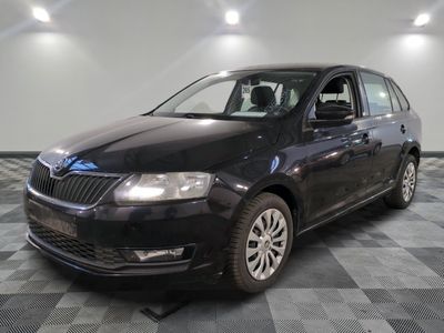 a picture of a black car parked in a showroom