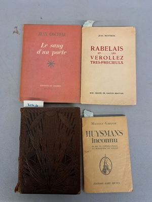 three books are sitting on a table next to each other