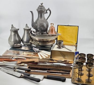 a lot of silver items that are sitting on a table