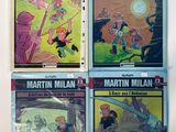 four books of martin millan comics on a white background