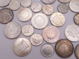 a lot of coins that are on the table