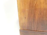 a wooden cabinet with a clock on top of it