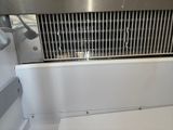 an image of a stainless steel grill in a kitchen