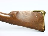 an old wooden rifle with a brass handle on a white background