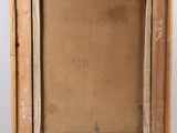 an old wooden easel with a painting on top of it