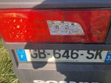 a close up of a license plate on a car ' s tail light