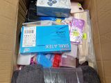 a cardboard box filled with assorted items in it