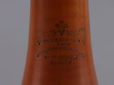 a brown vase that has a brown label on it