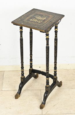 a small table with a book on top of it