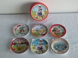 several tins of different types of tins sitting on a table