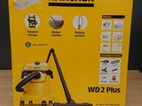 the box of a yellow vacuum cleaner is sitting on a table