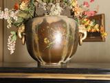 a vase with flowers in it sitting on a table