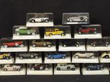 a lot of toy cars on display in a display case