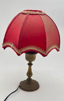 a red lamp that is sitting on a table