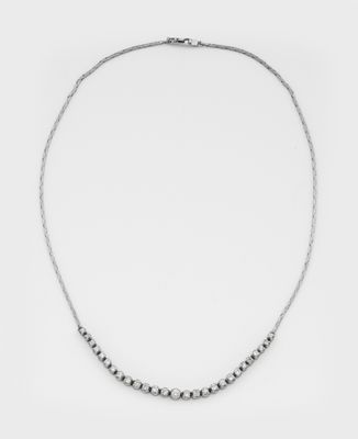 a silver beaded necklace on a white background