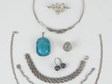 an assortment of jewelry including a necklace, bracelet, and ring