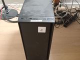 a computer that is sitting on the floor in the room