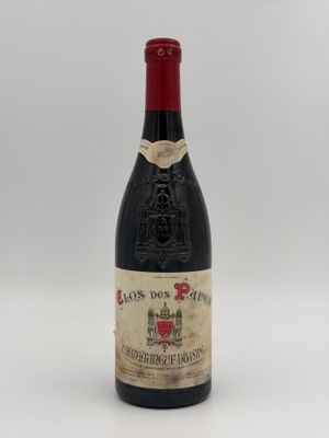 an image of a bottle of wine sitting on top of a table