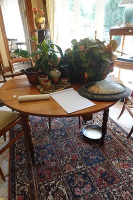 an image of a dining room with a table and chairs