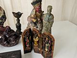 several figurines are sitting on a table next to a box