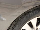 a close up of a car ' s tire with a sticker on it